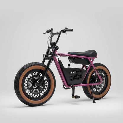 Purple electric bike with large wheels on a concrete surface, red garage door in the background