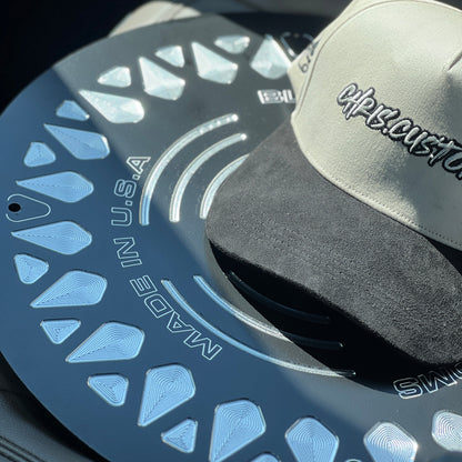 Cap and disc brake rotor with 'Made in U.S.A.' text on a dark background