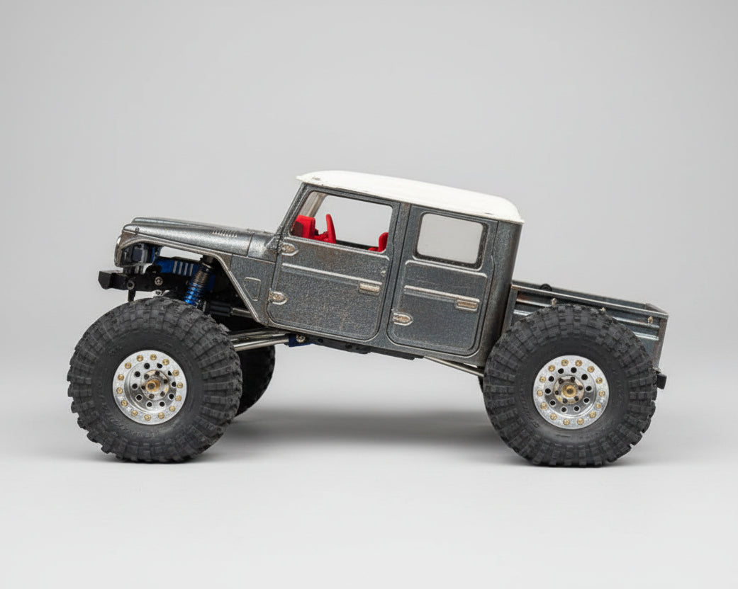 Model off-road vehicle on a rock with a natural background