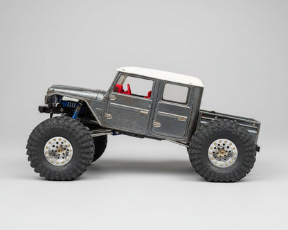 Model off-road vehicle on a rock with a natural background