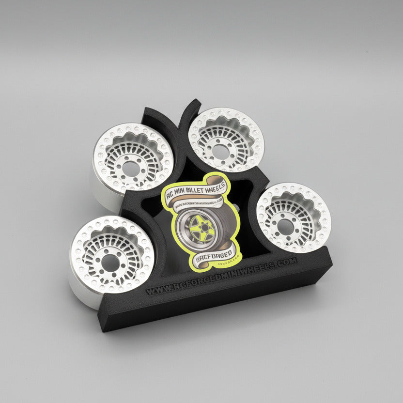 A set of gray beadlock wheels for remote control trucks, labeled with 'Sikander 27 - 1.9x1.