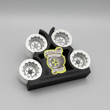 A set of gray beadlock wheels for remote control trucks, labeled with 'Sikander 27 - 1.9x1.