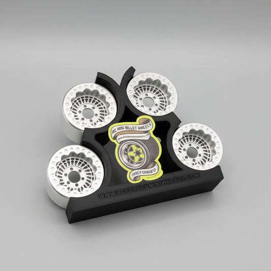 A set of gray beadlock wheels for remote control trucks, labeled with 'Sikander 27 - 1.9x1.